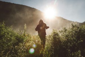 lady hiking in sunlight